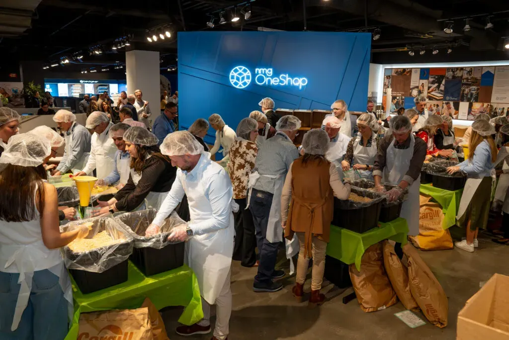 Group of people packing meals for a charitable event